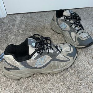 New Balance tennis shoes, grey and blue, says size 9 1/2 but fits like 9